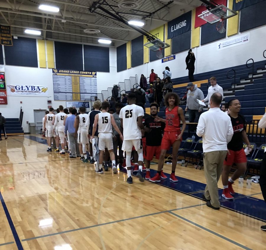 Grand Ledge shakes hands with the Sexton Big Reds after a 76-59 victory on December 11. The Comets are hoping to ride this wave of momentum heading into the bulk of conference play.