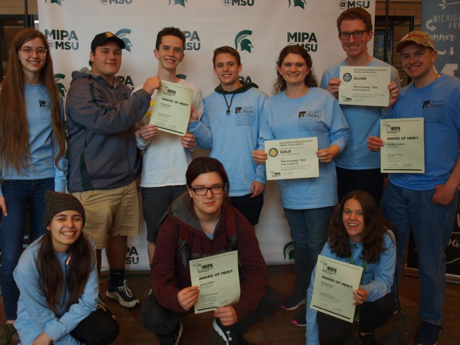 The Comets Tale staff poses with their Honorable Mention certificates and Silver and Gold Medal certificates for the newspaper and website. The Comets Tale attended the event on April 23 at the Lansing Center.