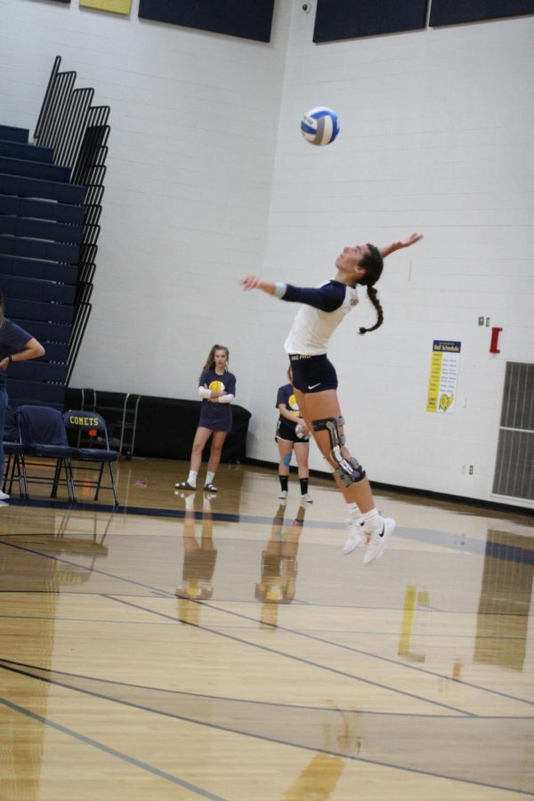 Senior Peyton Goschka serving during her most recent match. The team won against Waverly, the opposing team. 