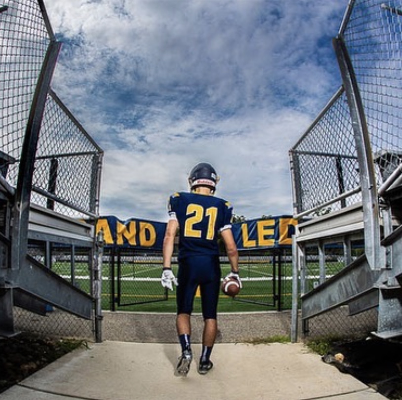 Cameron Roberts walking out through the Comets tunnel. Cam is sporting number twenty-one this year.