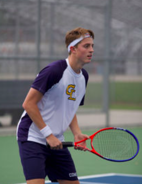 Tyler+McCready+stands+ready+as+his+opponent+serves.+This+was+McCreadys+first+year+on+the+tennis+team.