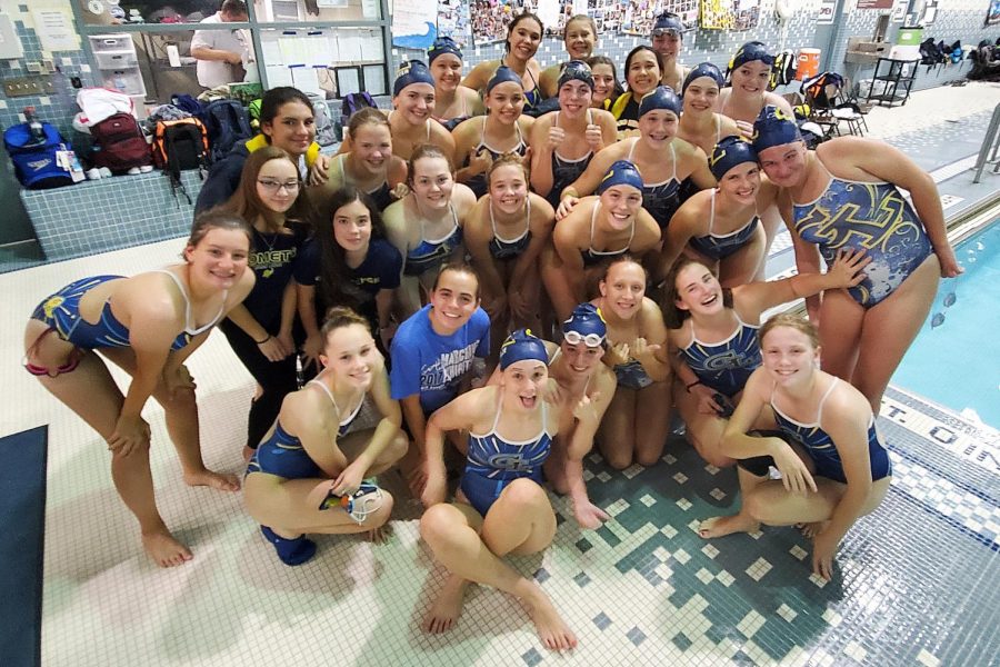 Varsity+Girls+swim+team+poses+together+at+their+meet+in+Okemos+on+September+19.+GL+swam+away+with+a+win%21