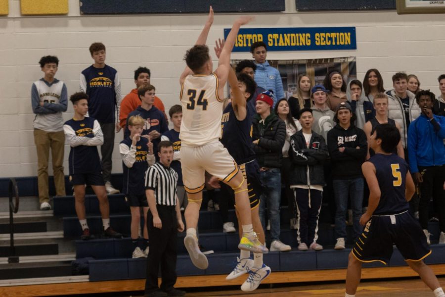 The Ledge played a fantastic game against Haslett. Devan Wilson is pictured taking a great jump shot.