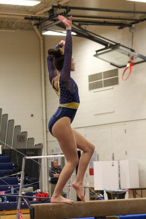 Taking on the beam, Alana Chapman dominates her routine. GL Varsity Gymnastics ended up winning the meet against Escanaba.