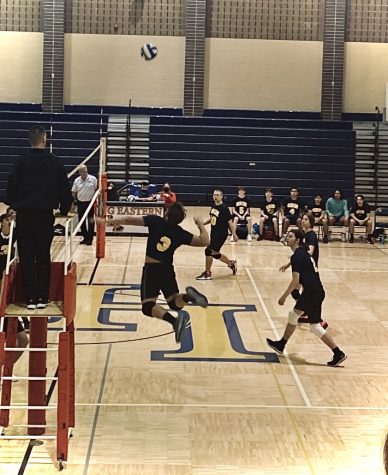 Number Three Austin Chamblee jumps up to get the kill. Grand Ledge played  Lansing Christian in their last game.
