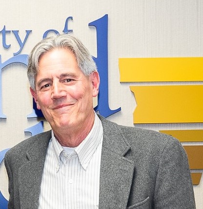 Mr. Sowle is shown smiling at City Hall. He could always be found helping around the community.