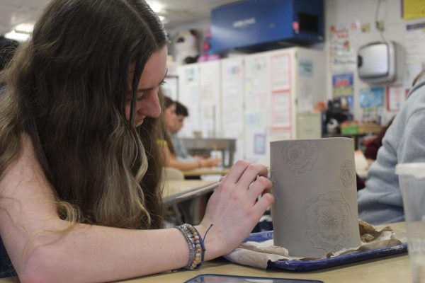 Layna Norick carves intricate details into her ceramics project. After Vandyke-Moore retired, Thompson took over instructing the course for the remainder of the 2023-2024 school year.