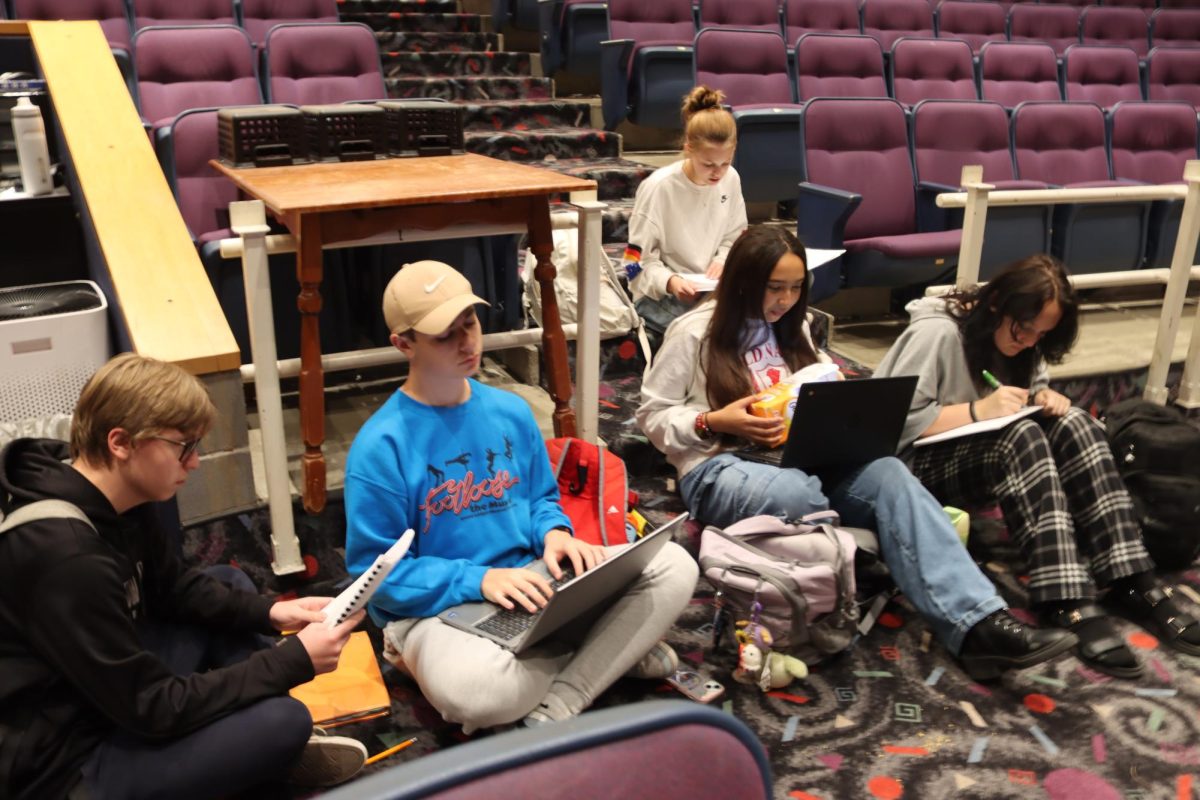  Students completing school 
assignments  at musical rehearsal during their breaks.
