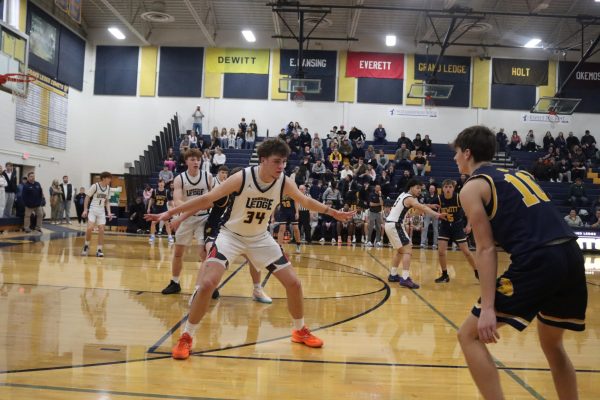 James guarding Dewitt's #10 as he tries to shoot and score. The boys won against Dewitt that night as the final score was 70-48.